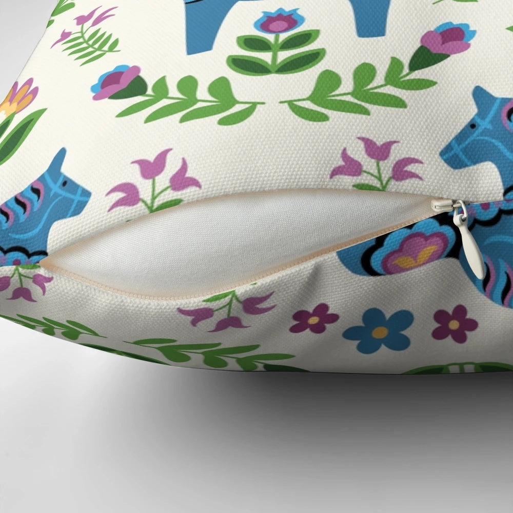 A vibrant blue Dala horse pillow, a classic symbol of Swedish folk art and Scandinavian design.