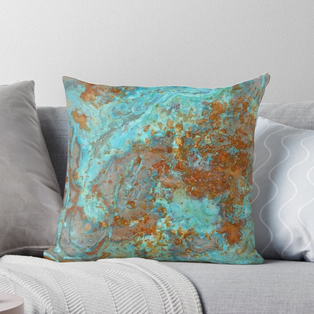 Teal and copper-colored decorative pillow with a marble-like effect, perfect for modern home decor.