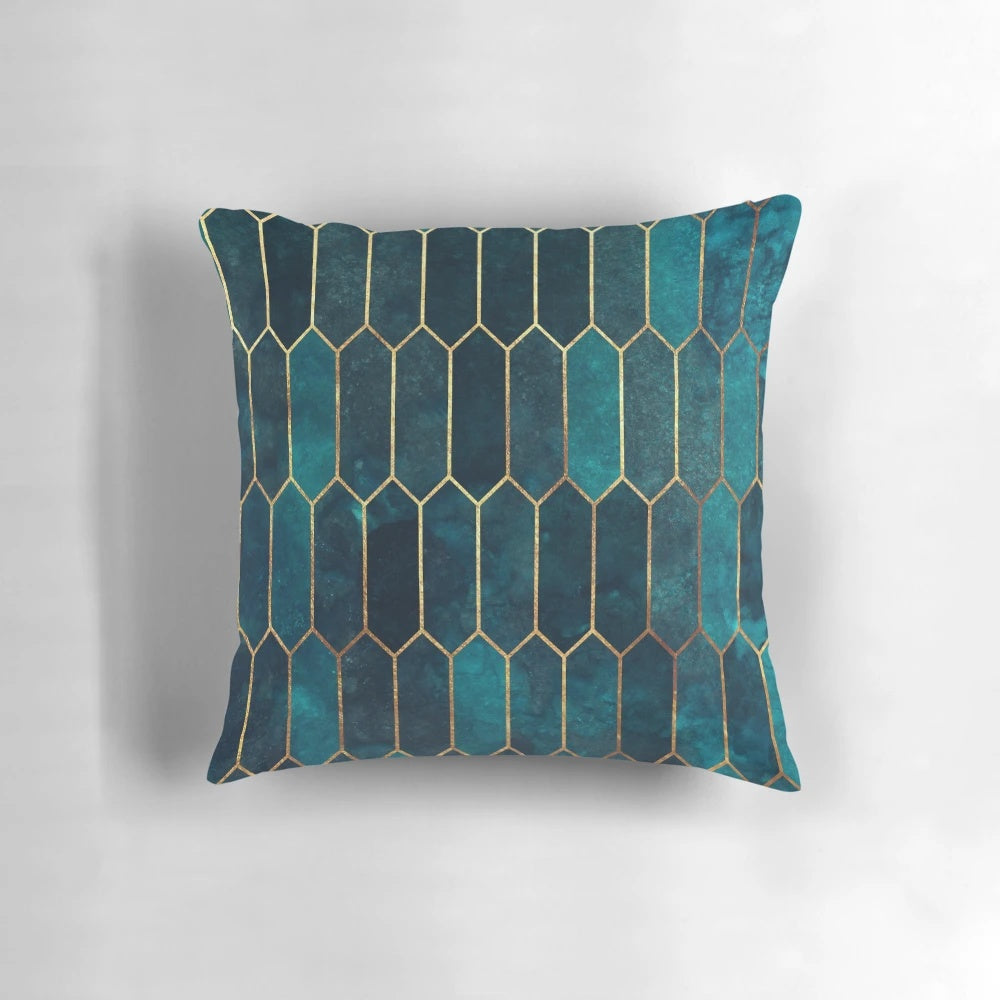 Teal and gold geometric patterned decorative pillow