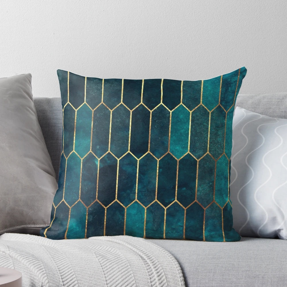 Teal and gold geometric patterned decorative pillow