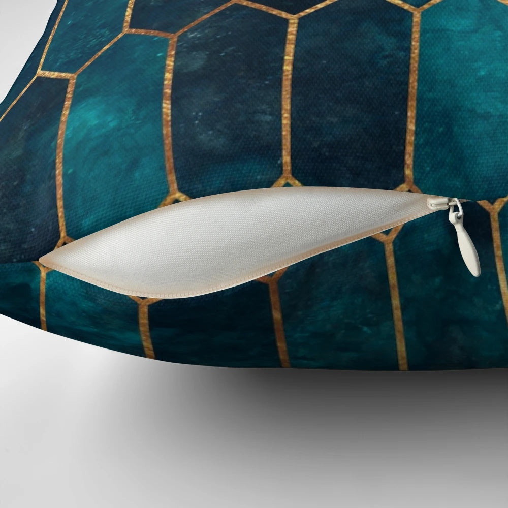 Teal and gold geometric patterned decorative pillow