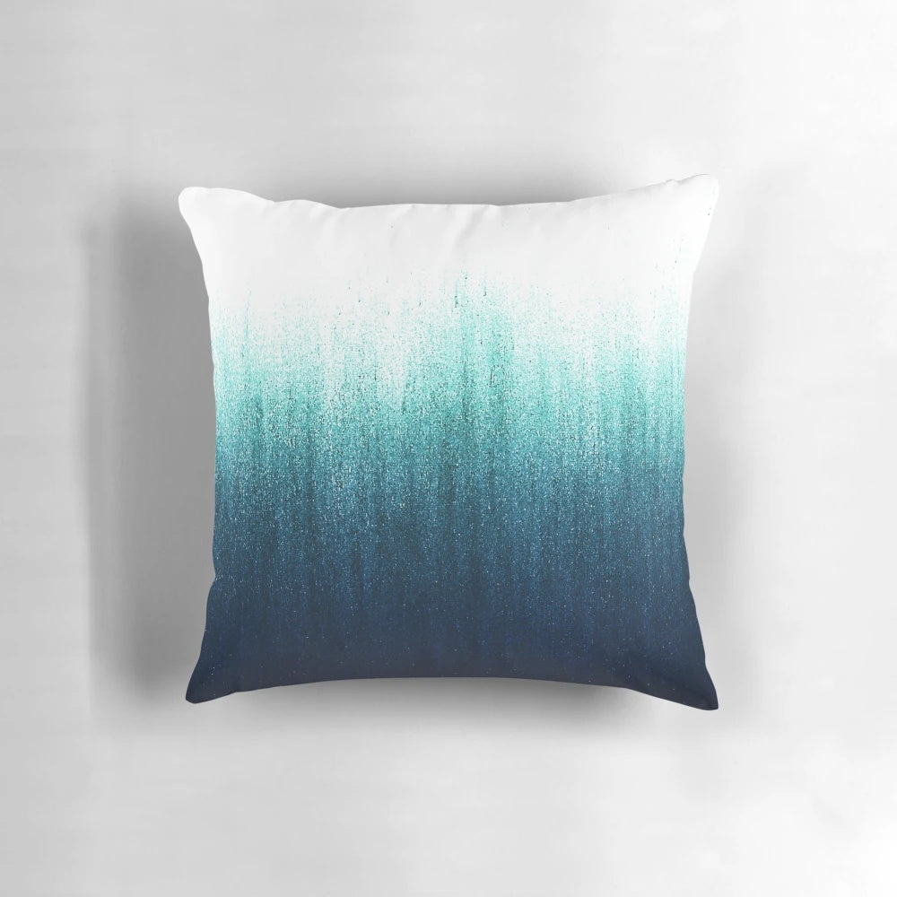 Teal and charcoal ombre decorative throw pillow with a minimalist, ocean-inspired design
