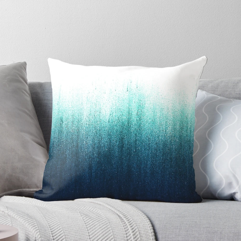 Teal and charcoal ombre decorative throw pillow with a minimalist, ocean-inspired design