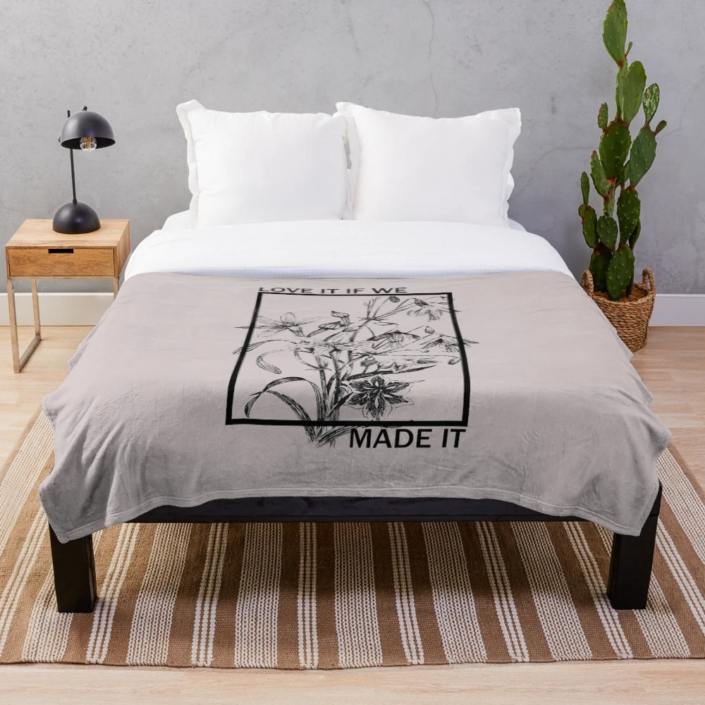 Minimalist sketch-style plush blanket featuring the lyrics "Love it If We Made It" from the band The 1975