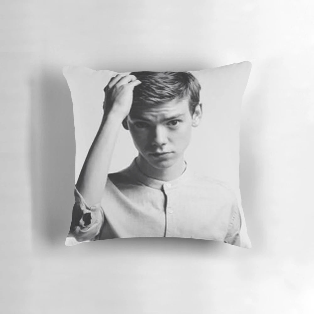 Decorative throw pillow featuring a portrait of actor Thomas Brodie-Sangster