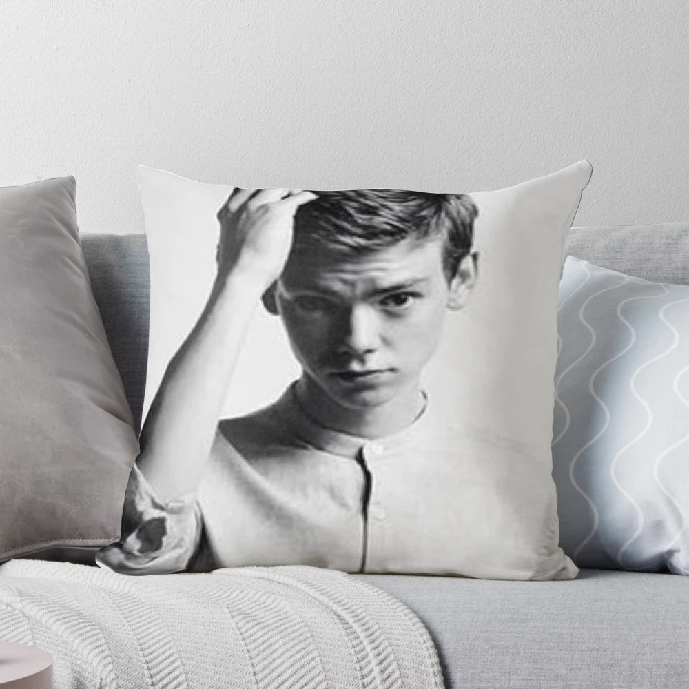 Decorative throw pillow featuring a portrait of actor Thomas Brodie-Sangster
