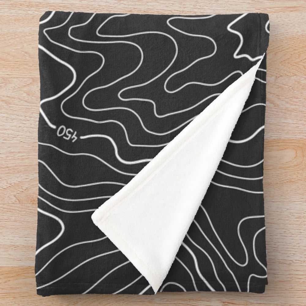 Topography plush blanket with minimalist black and white design