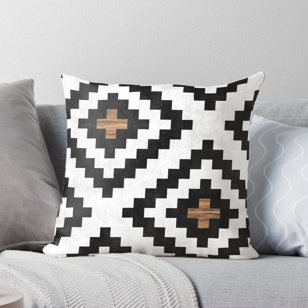 Tribal pattern pillow with concrete and wood accents, perfect for boho-inspired home decor