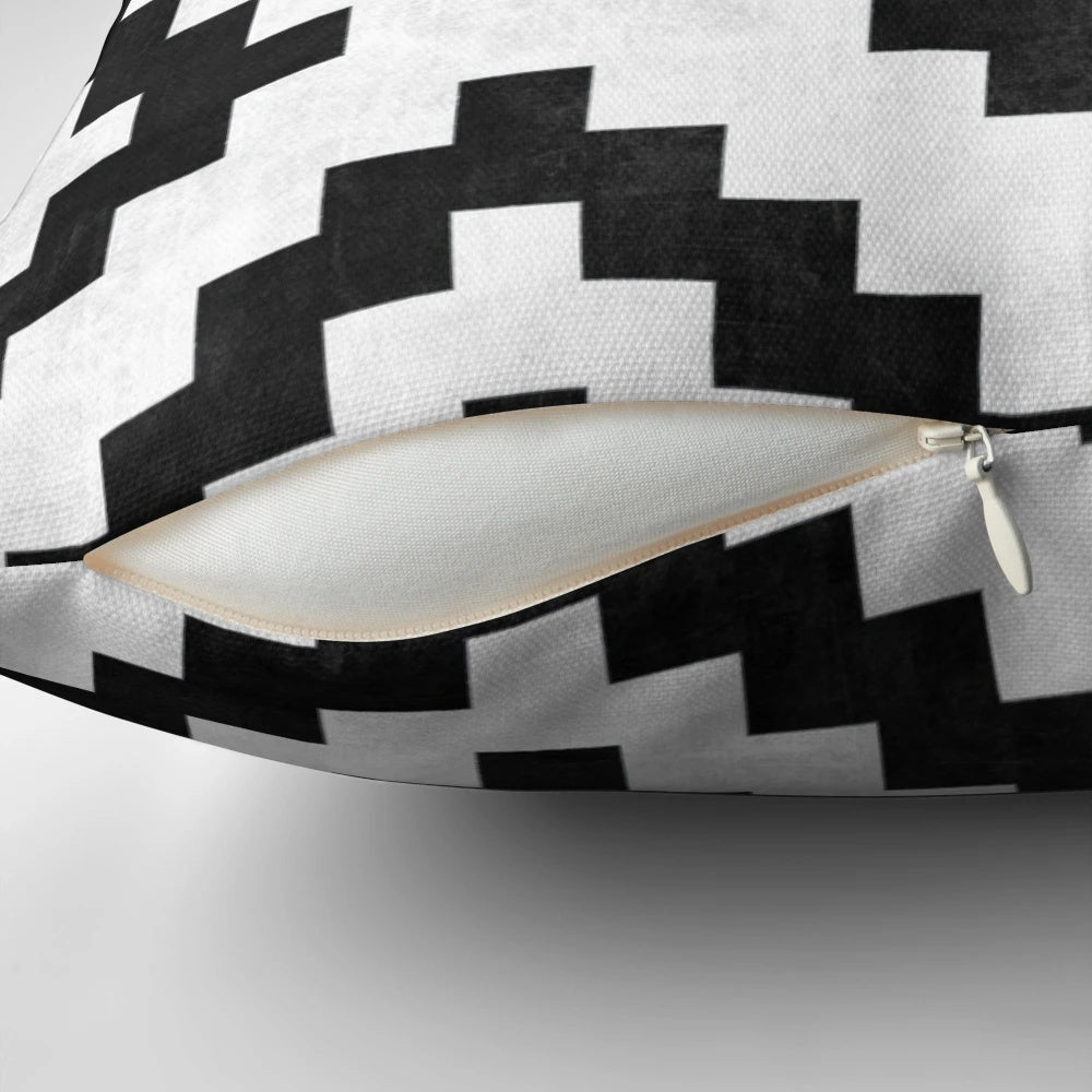 Tribal pattern pillow with concrete and wood accents, perfect for boho-inspired home decor