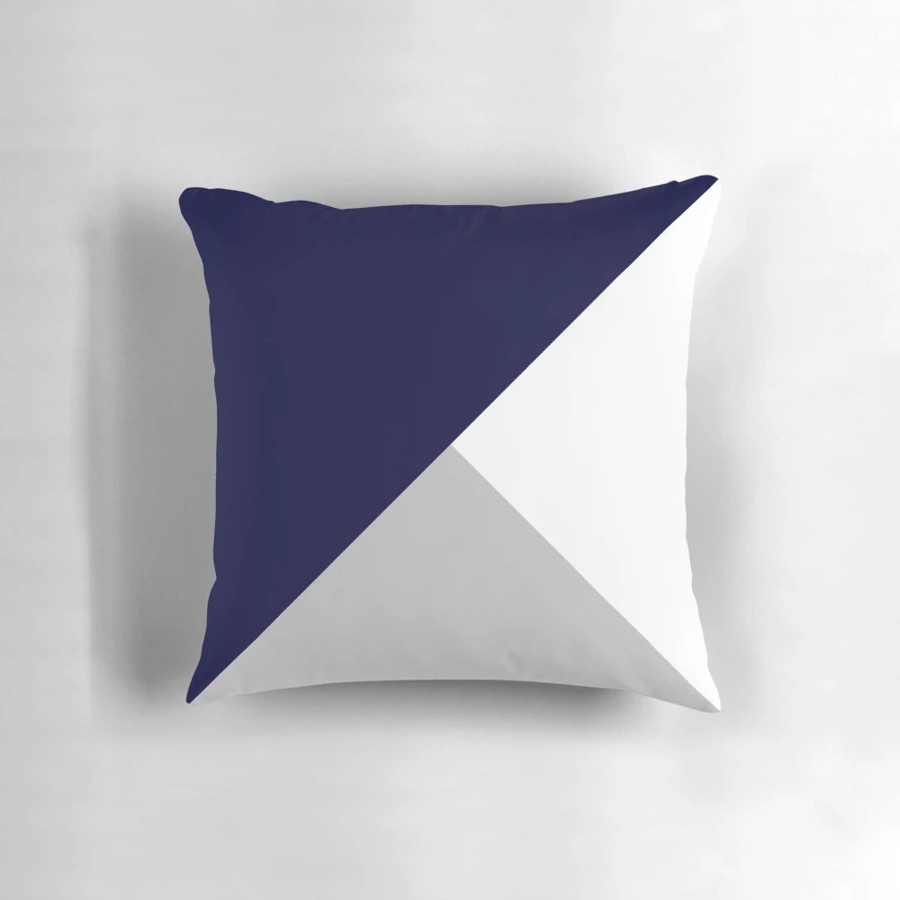 Navy blue, gray, and white geometric pattern pillow