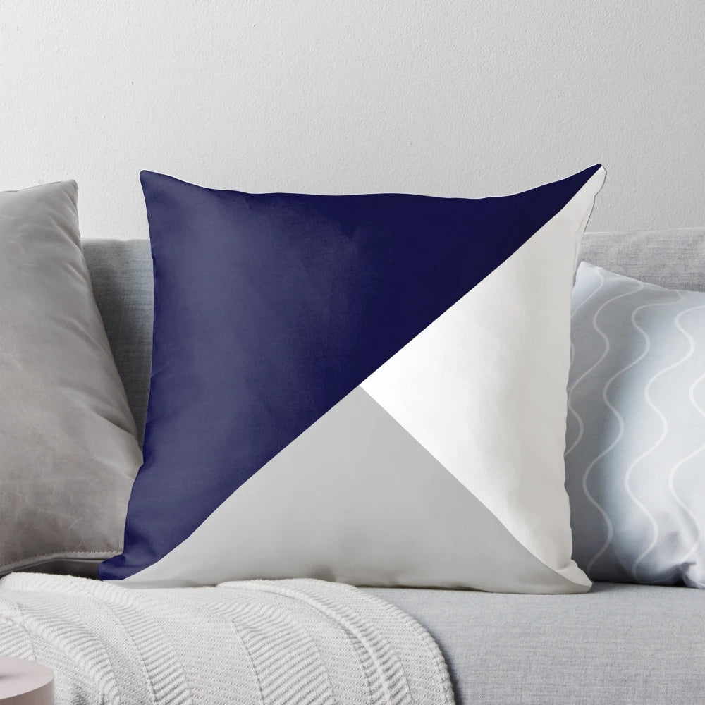 Navy blue, gray, and white geometric pattern pillow