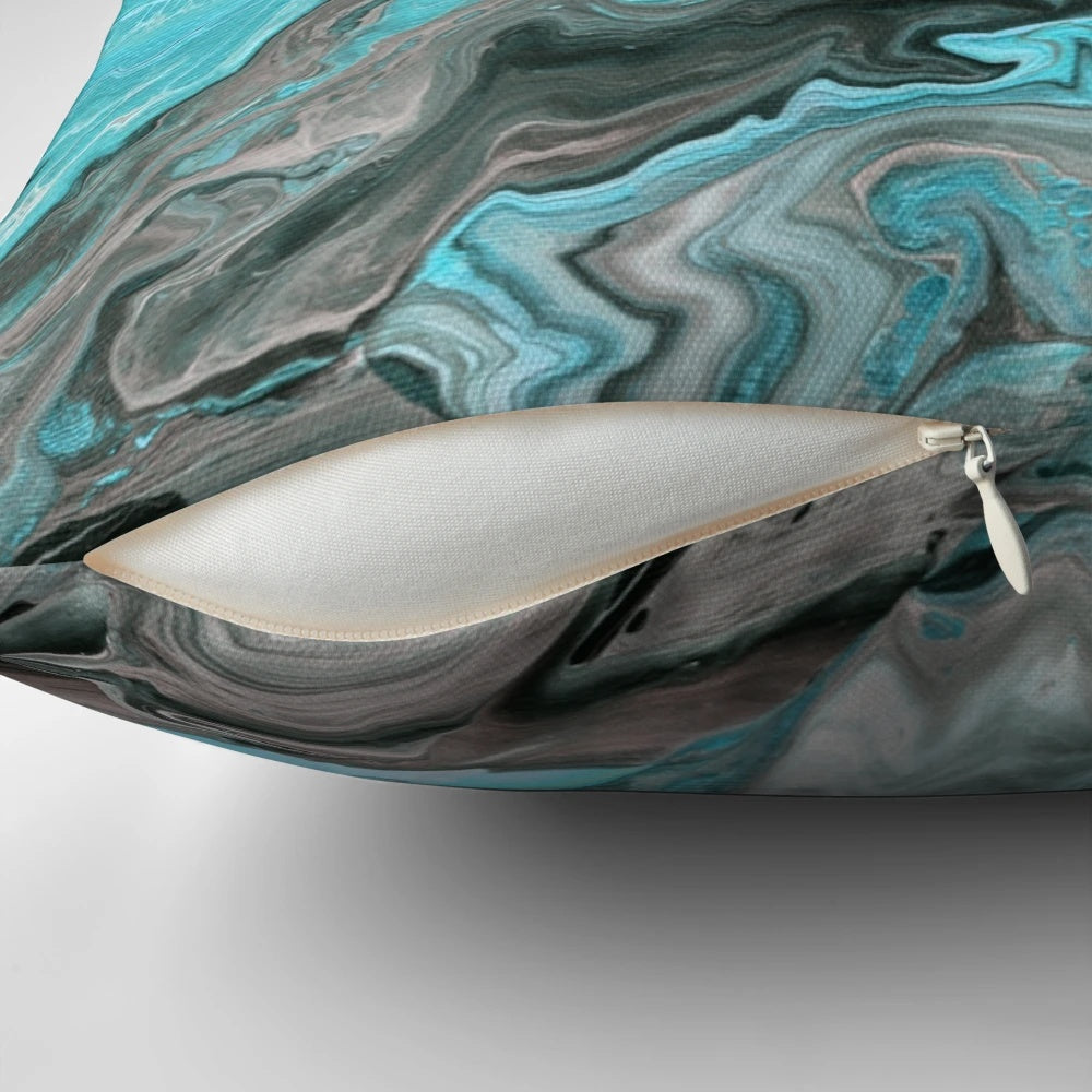 Turquoise marble-patterned pillow with a modern paint pour design