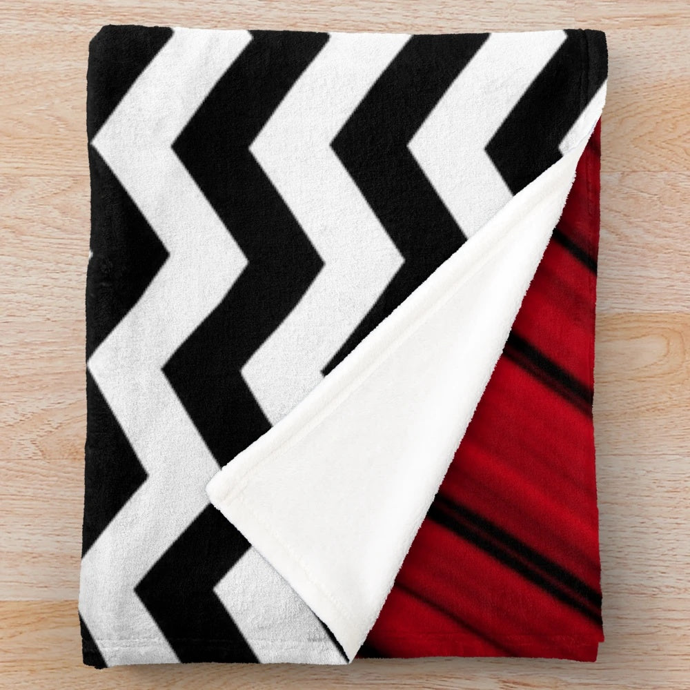 Cozy and stylish plush blanket featuring a black and white chevron design, inspired by the iconic TV series Twin Peaks.