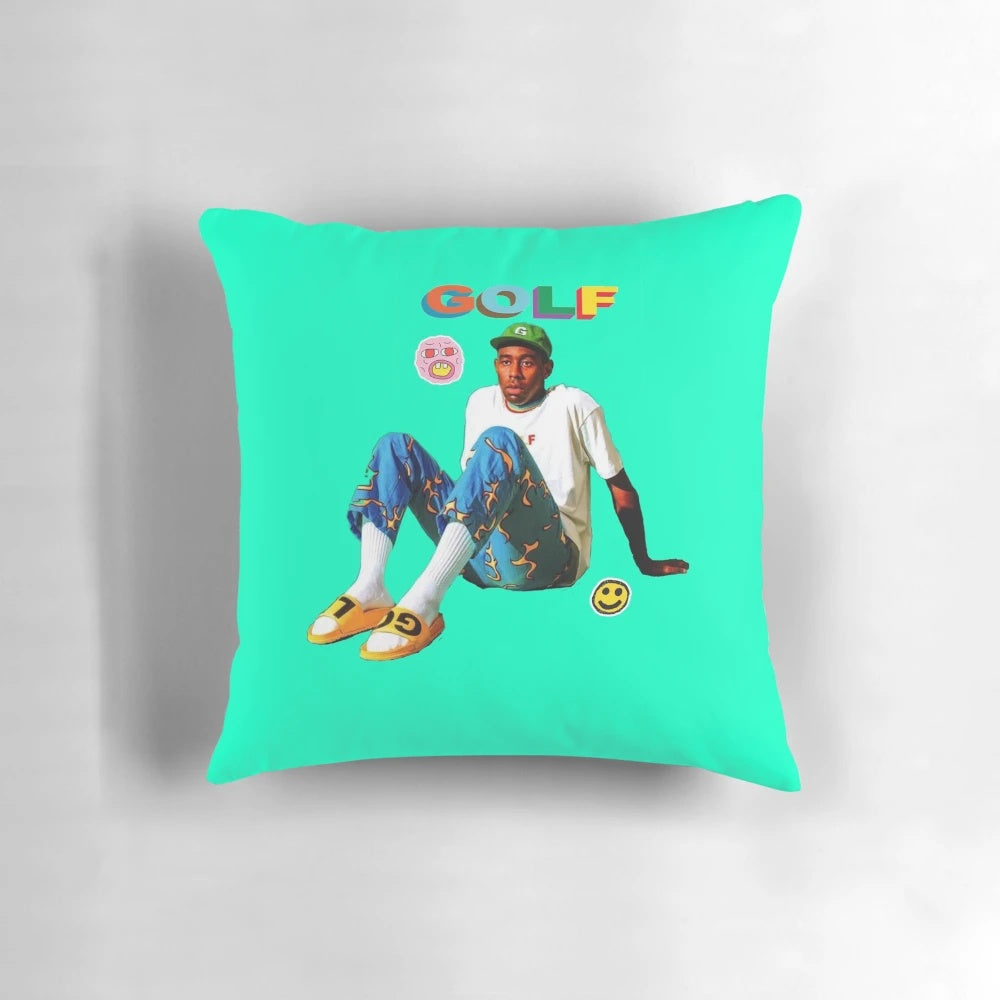 A blue and teal throw pillow with the Tyler, The Creator aesthetic design