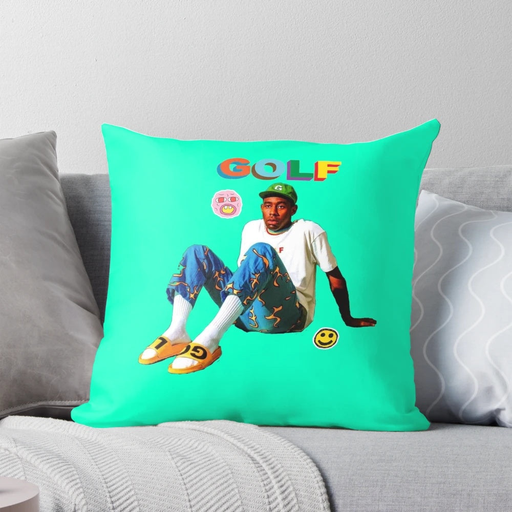 A blue and teal throw pillow with the Tyler, The Creator aesthetic design