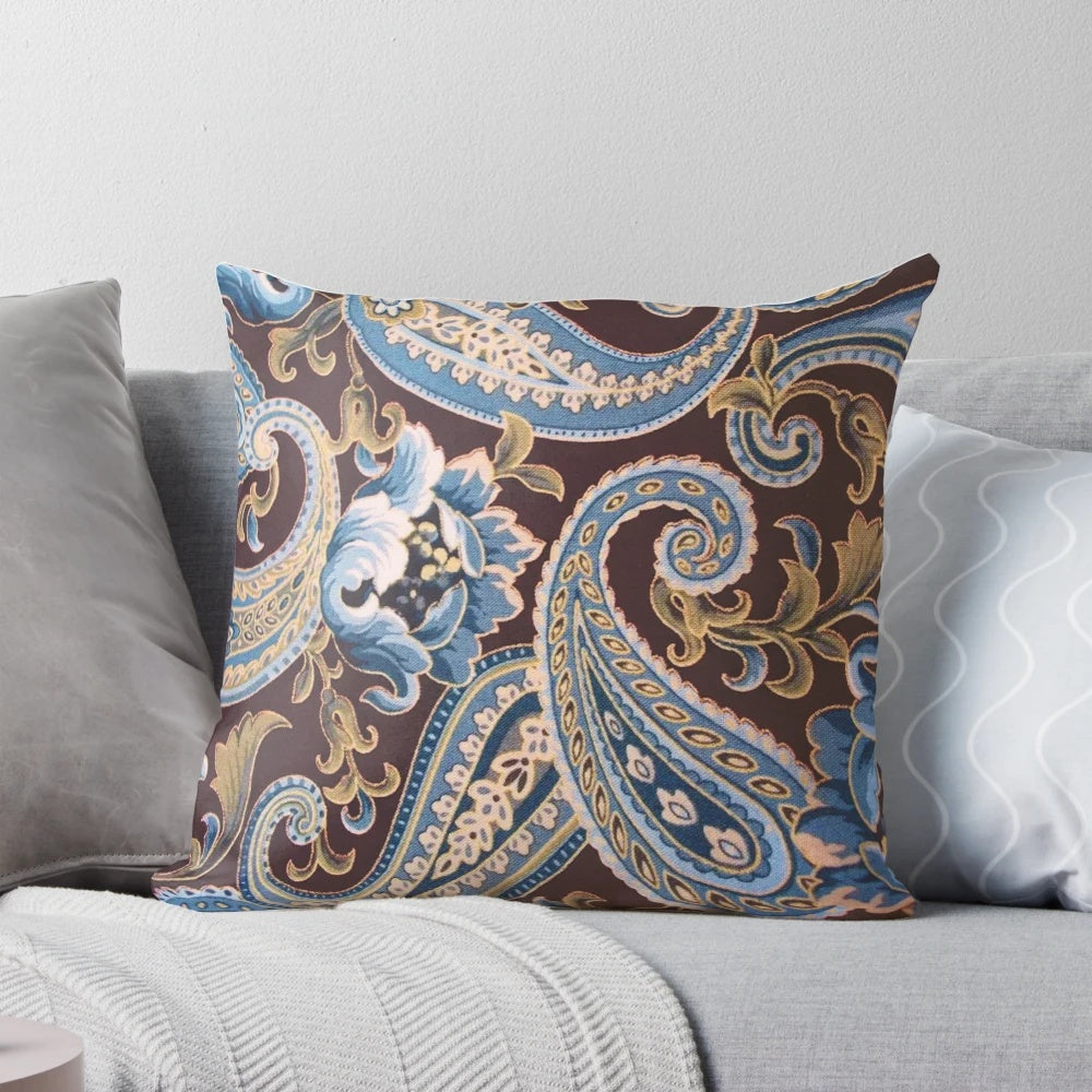Vintage-inspired paisley pattern pillow in shades of blue and brown