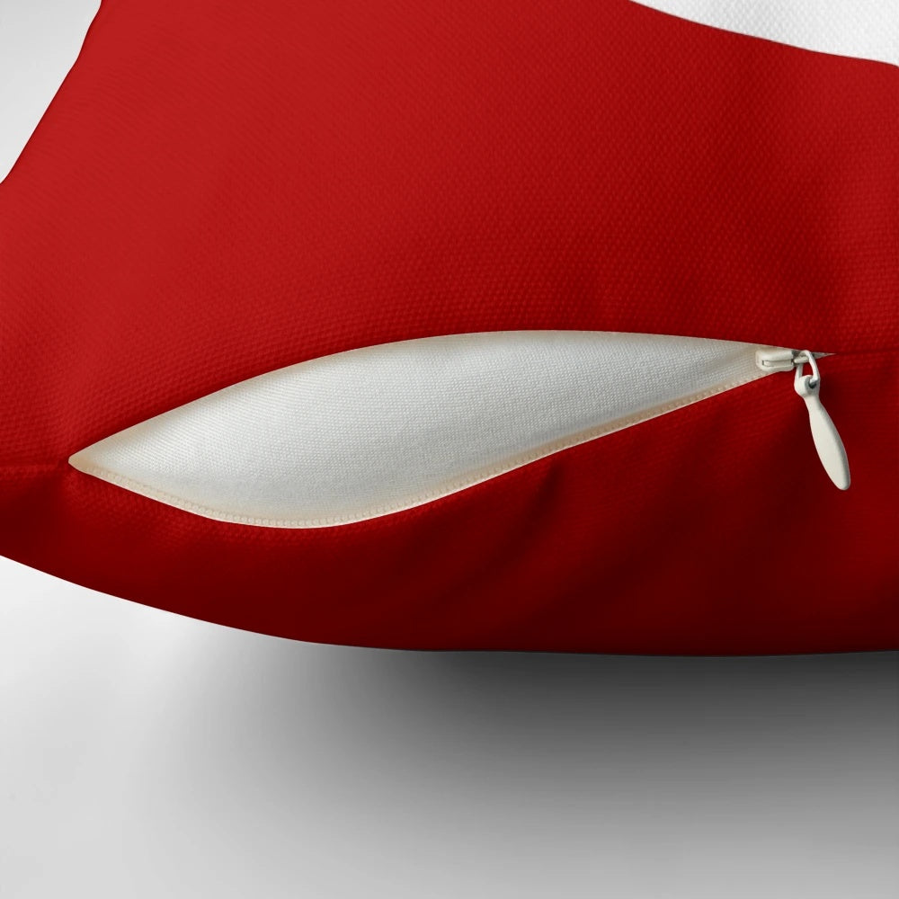 White anchor design on a medium red pillow, perfect for nautical and coastal home decor.