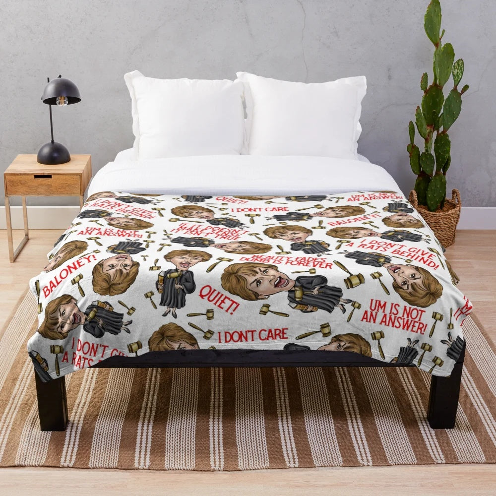 White plush blanket featuring a Judge Judy graphic design