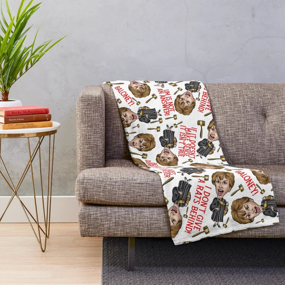White plush blanket featuring a Judge Judy graphic design