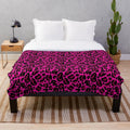 Vibrant hot pink and leopard print plush blanket