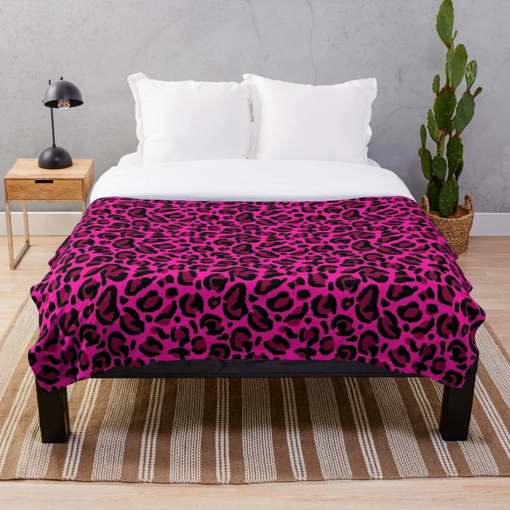 Vibrant hot pink and leopard print plush blanket