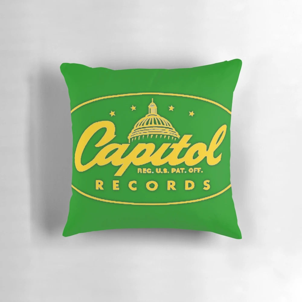 A yellow pillow featuring a music label-inspired design, perfect for music lovers.