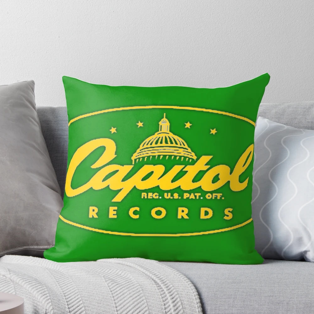 A yellow pillow featuring a music label-inspired design, perfect for music lovers.