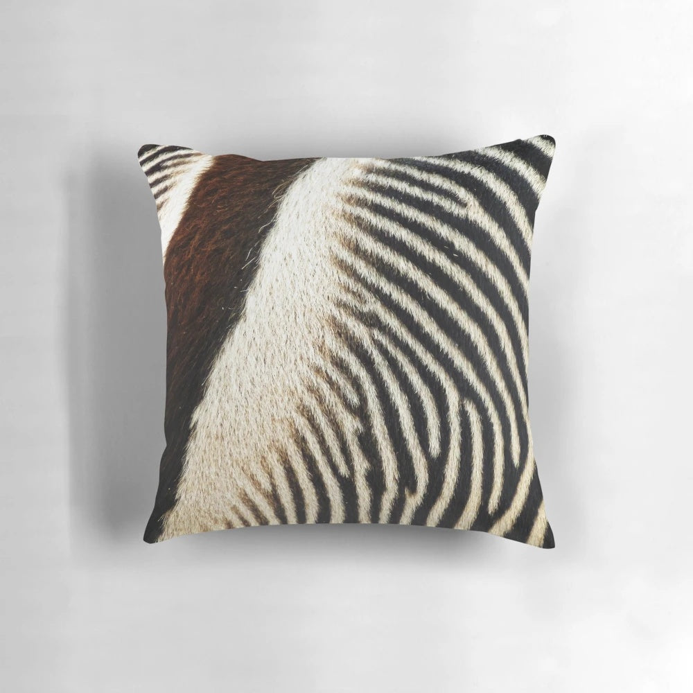 Decorative throw pillow featuring a striking zebra-inspired abstract pattern in black and white.