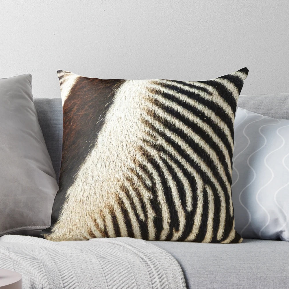 Decorative throw pillow featuring a striking zebra-inspired abstract pattern in black and white.