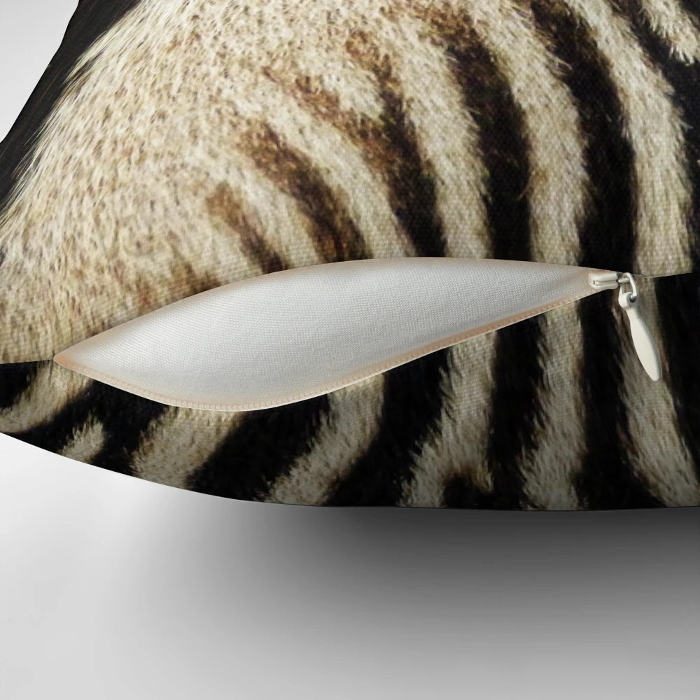 Decorative throw pillow featuring a striking zebra-inspired abstract pattern in black and white.