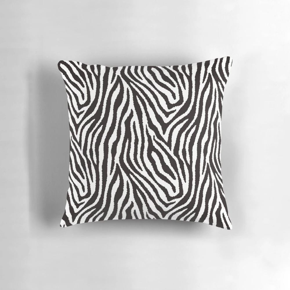 Decorative throw pillow featuring a striking black and white zebra pattern design