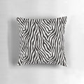 Decorative throw pillow featuring a striking black and white zebra pattern design