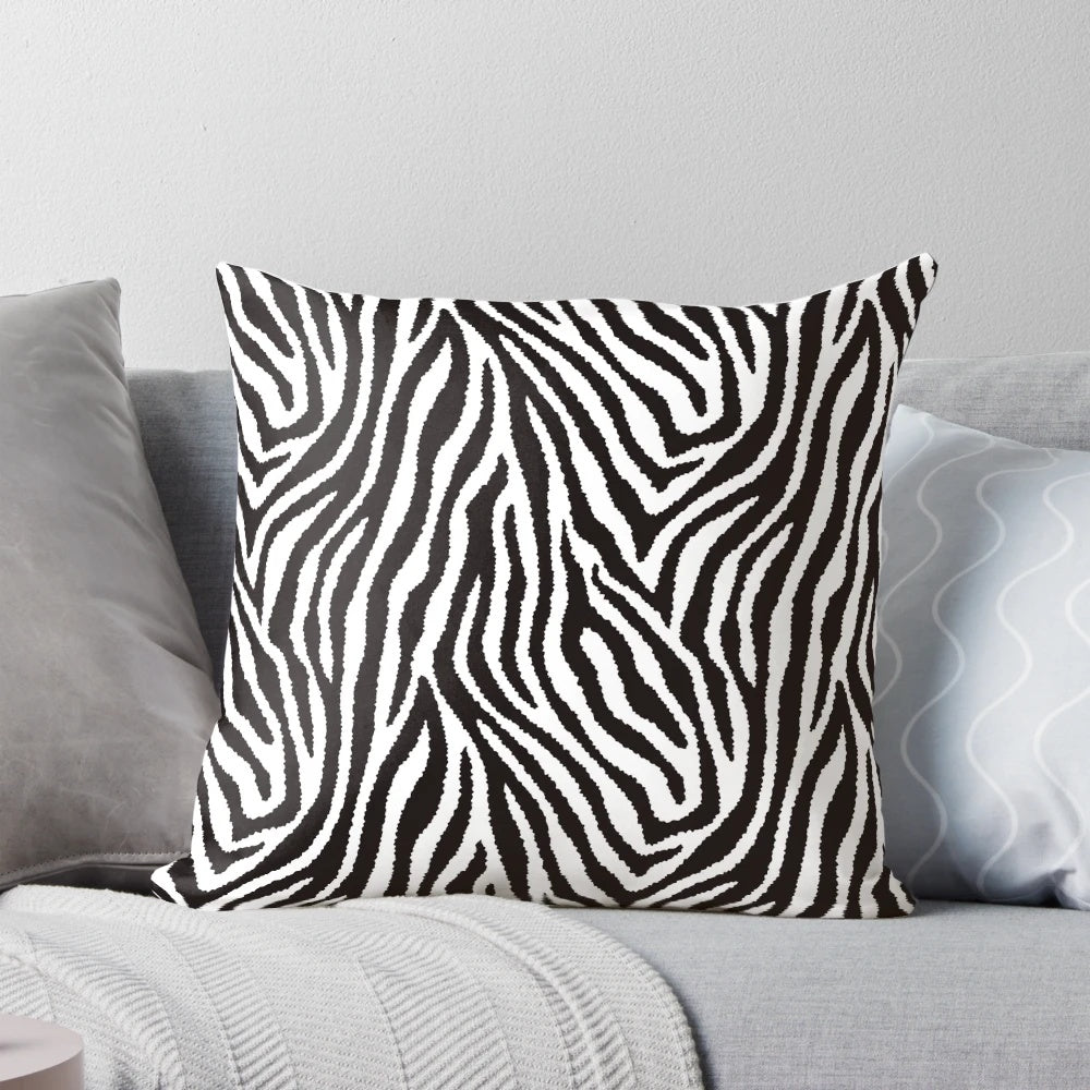 Decorative throw pillow featuring a striking black and white zebra pattern design