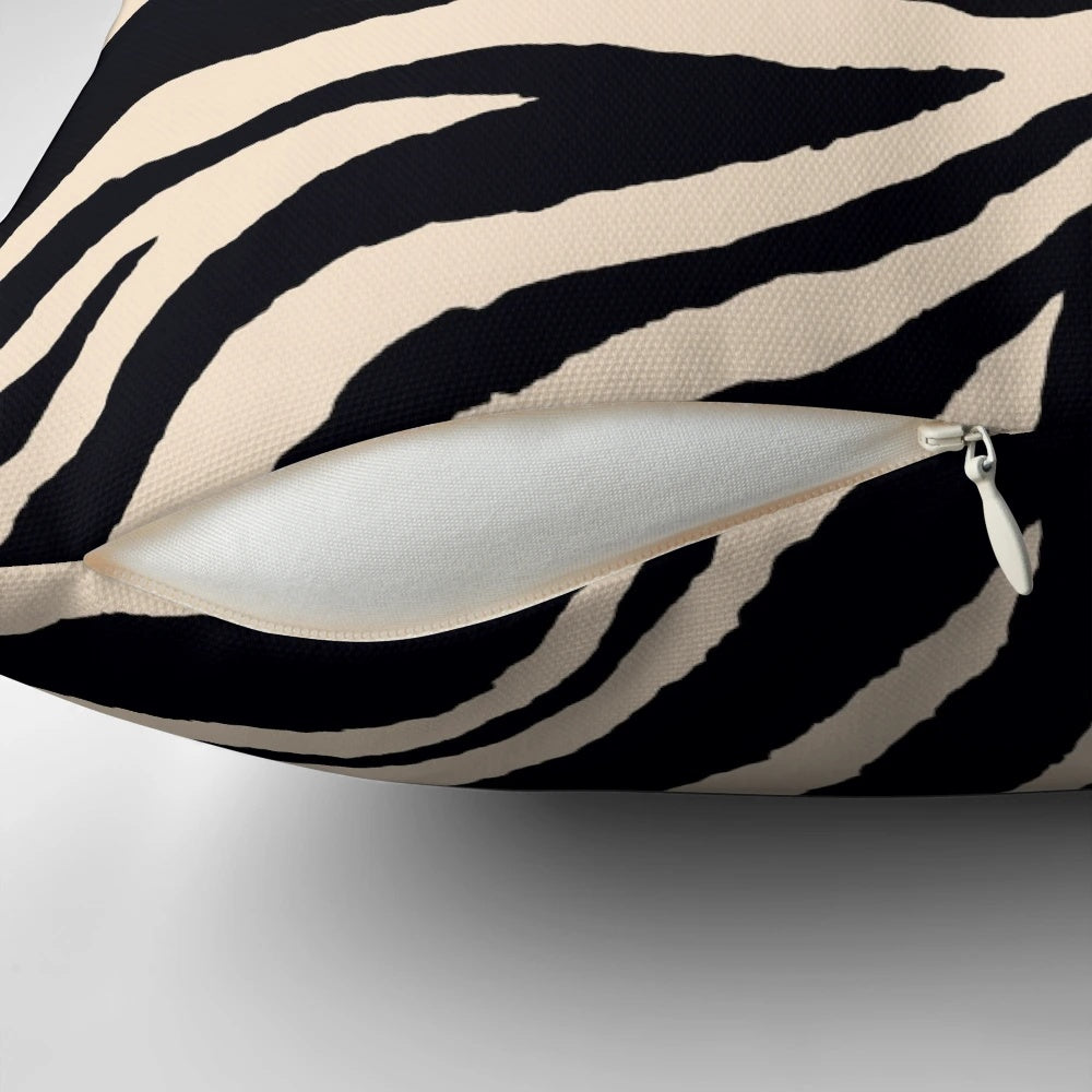 Zebra print accent pillow with a modern black and white graphic design
