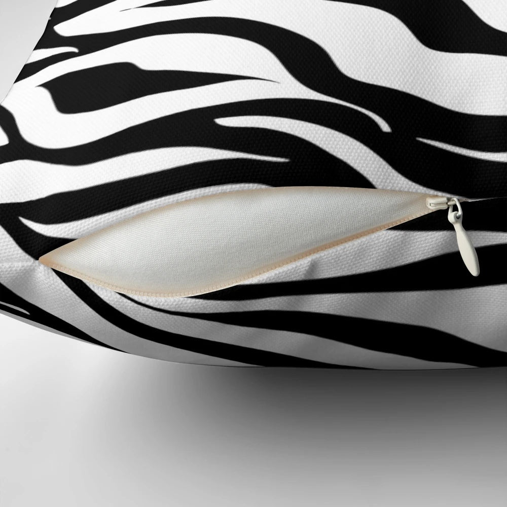 Zebra print pillow with a bold, eye-catching black and white design