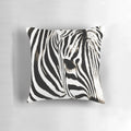 Closeup image of a black and white striped zebra print decorative throw pillow