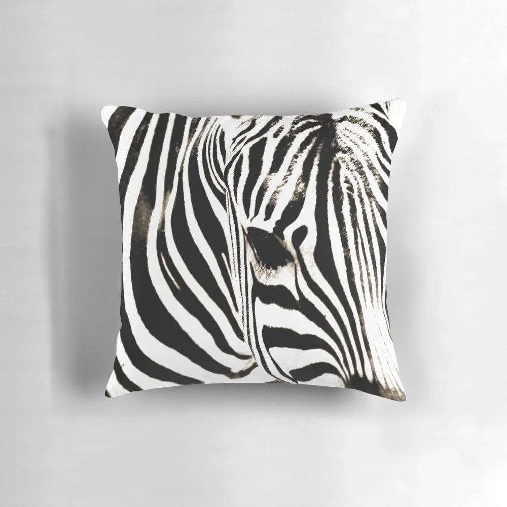 Closeup image of a black and white striped zebra print decorative throw pillow
