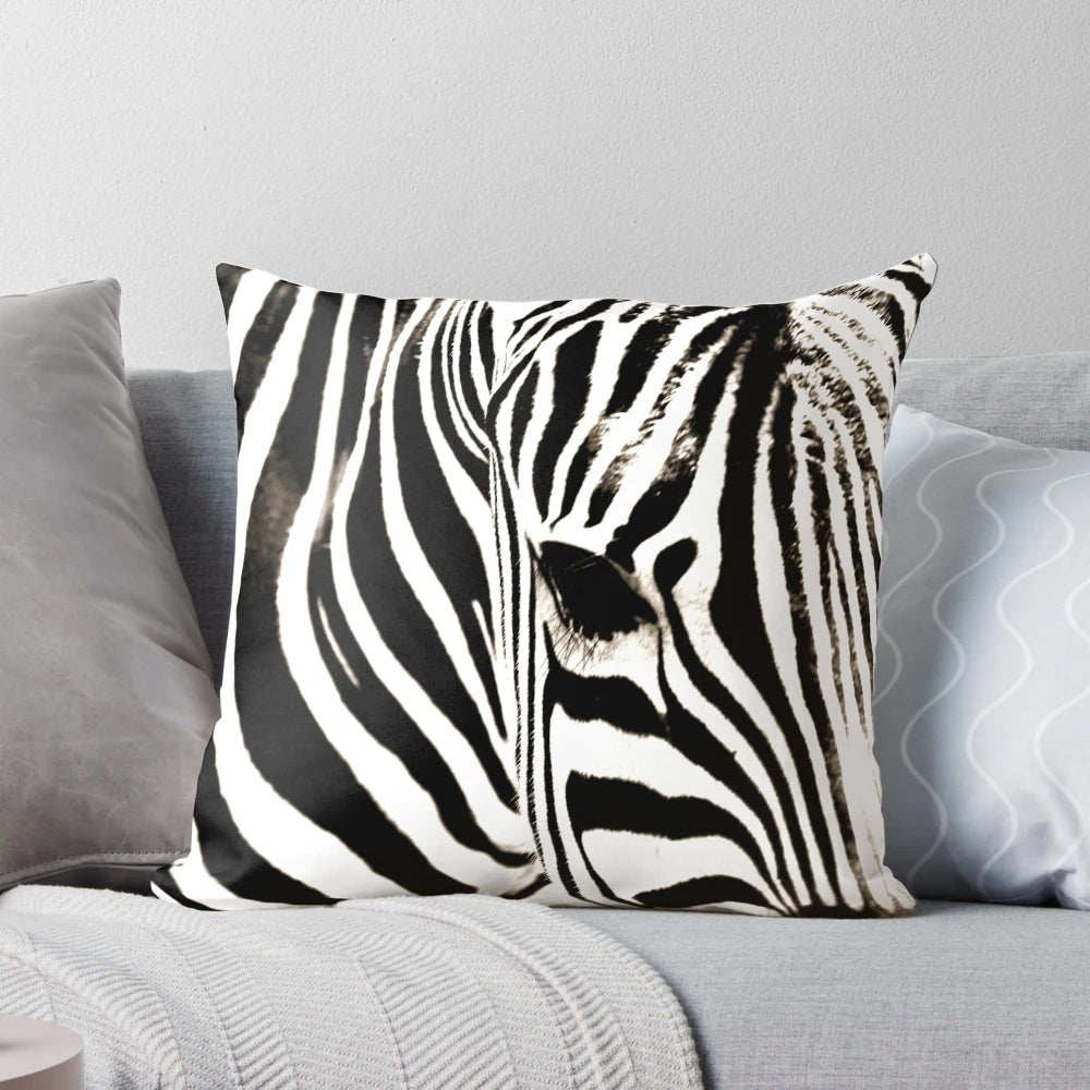 Closeup image of a black and white striped zebra print decorative throw pillow