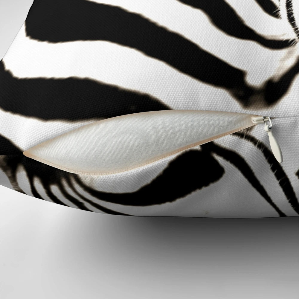 Closeup image of a black and white striped zebra print decorative throw pillow