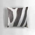 Zebra-patterned pillow in black and white
