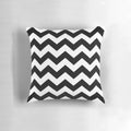 Black and white zig zag pattern throw pillow with a contemporary, minimalist design.