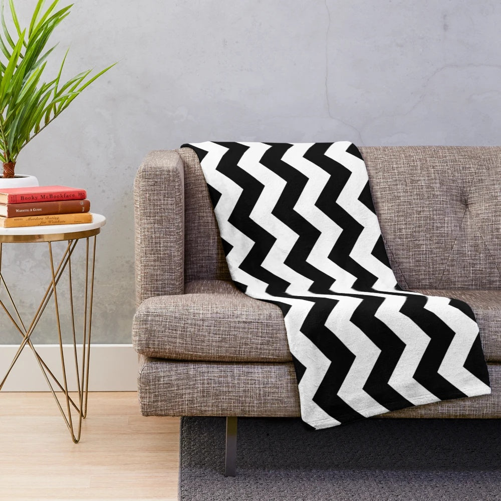 Zig zag patterned plush blanket in black and white colors