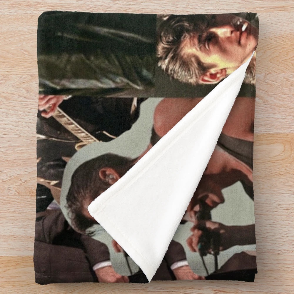 Stylized collage design featuring Alex Turner of the band Arctic Monkeys printed on a plush blanket
