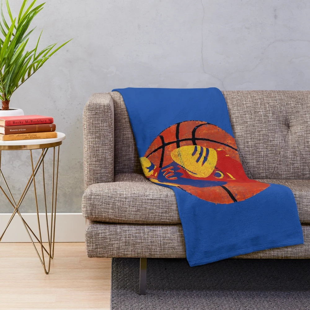 Plush blanket featuring the KU Jayhawks college basketball mascot