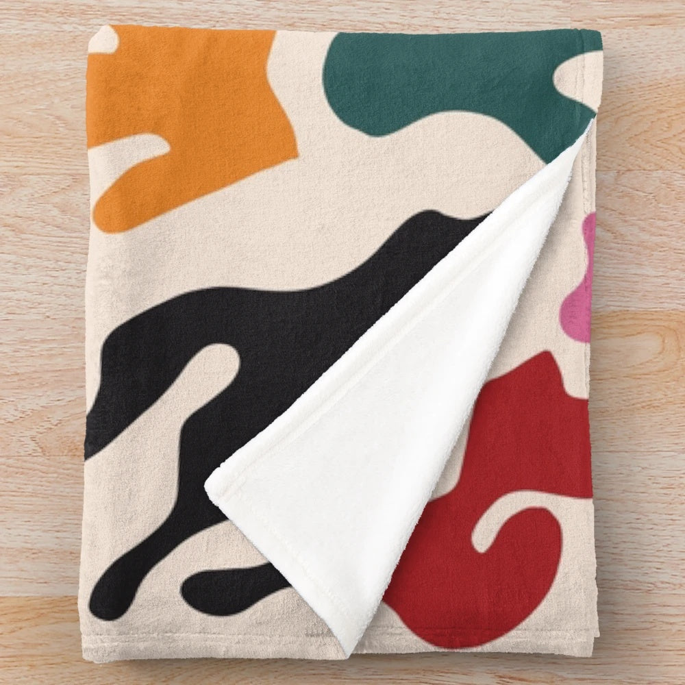Matisse-inspired plush blanket with vibrant abstract patterns