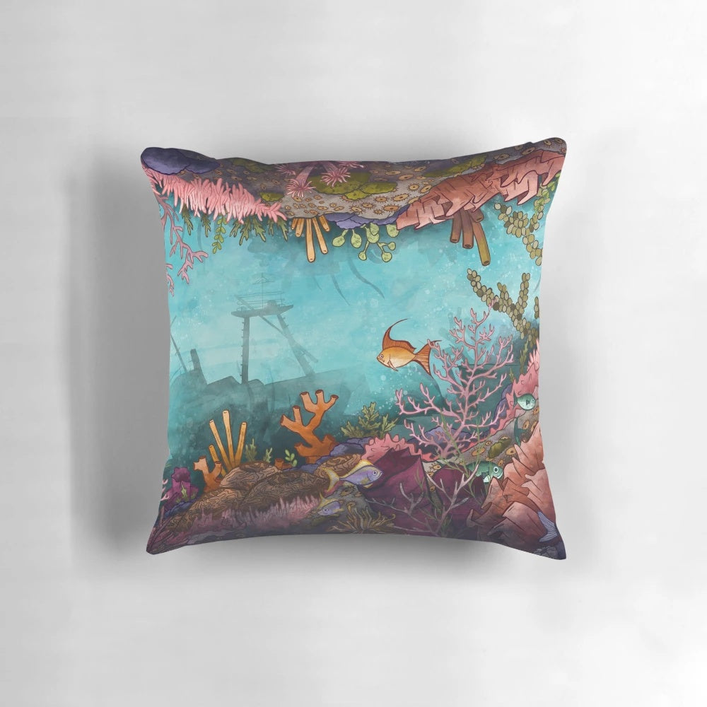 Submerged pillow featuring a vibrant underwater seascape design with coral reef, tropical fish, and neon colors.