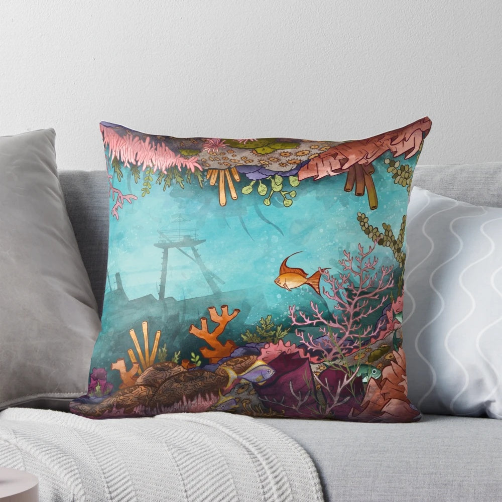 Submerged pillow featuring a vibrant underwater seascape design with coral reef, tropical fish, and neon colors.