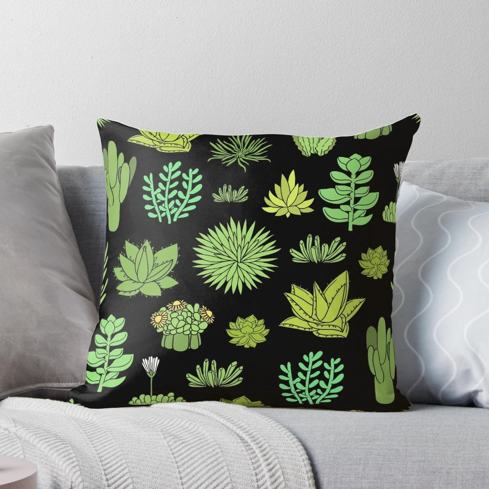 A decorative pillow featuring a pattern of succulents and cacti, perfect for plant lovers.