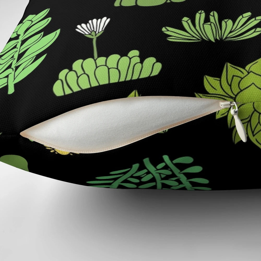 A decorative pillow featuring a pattern of succulents and cacti, perfect for plant lovers.