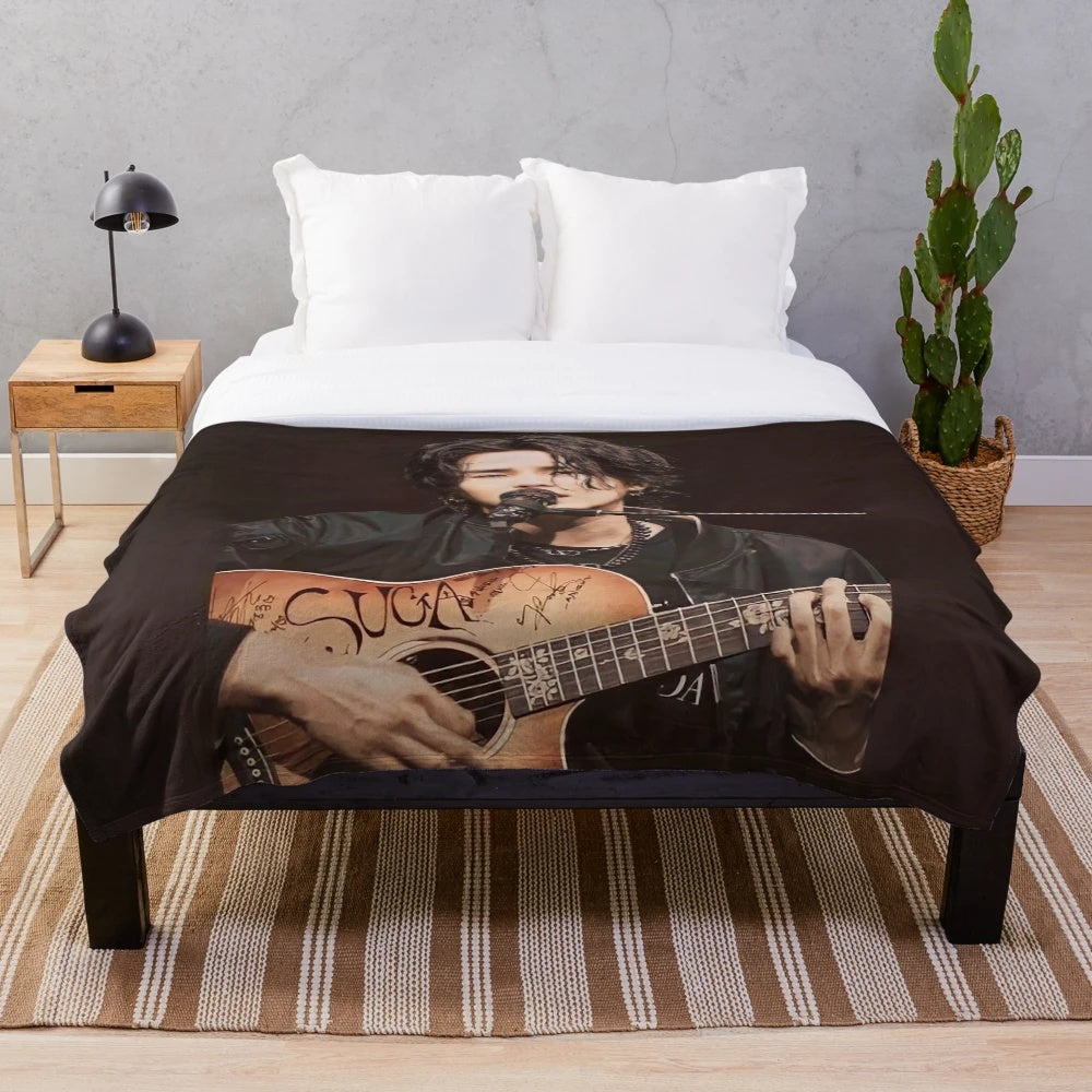 Plush blanket featuring an illustration of BTS member Min Yoongi, also known as Suga or Agust D